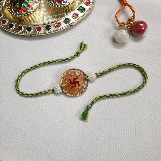 Swastik Rakhi Filled With Gold Flake