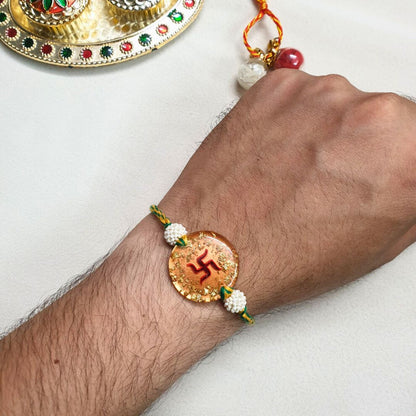 Swastik Rakhi Filled With Gold Flake